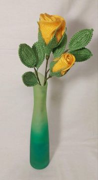 Yellow knitted rose