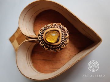 Birch bark ring inlaid with Baltic amber