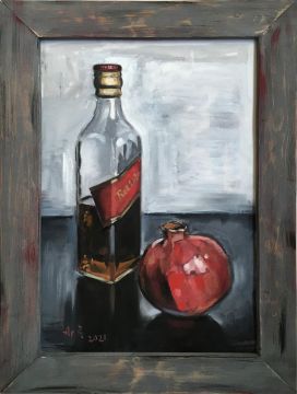 Still life with pomegranate and a bottle of whiskey